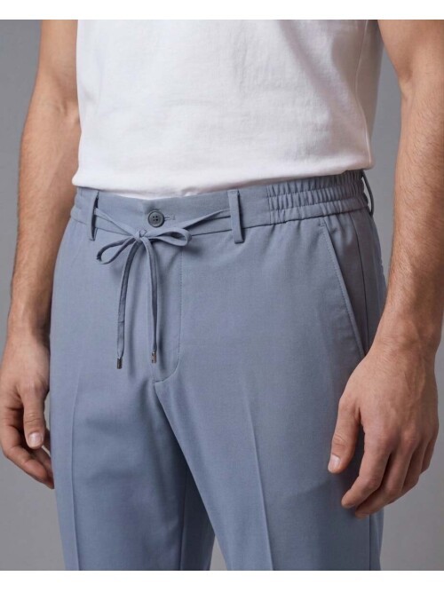 Blending modern safari inspiration with advanced performance fabric technology, this blue mens suit offers ultimate freedom of movement with its comf