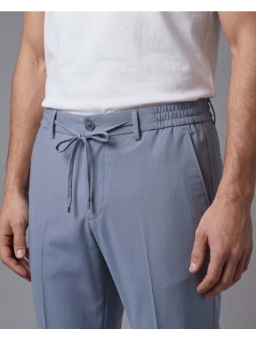 Blending modern safari inspiration with advanced performance fabric technology, this blue mens suit offers ultimate freedom of movement with its comf